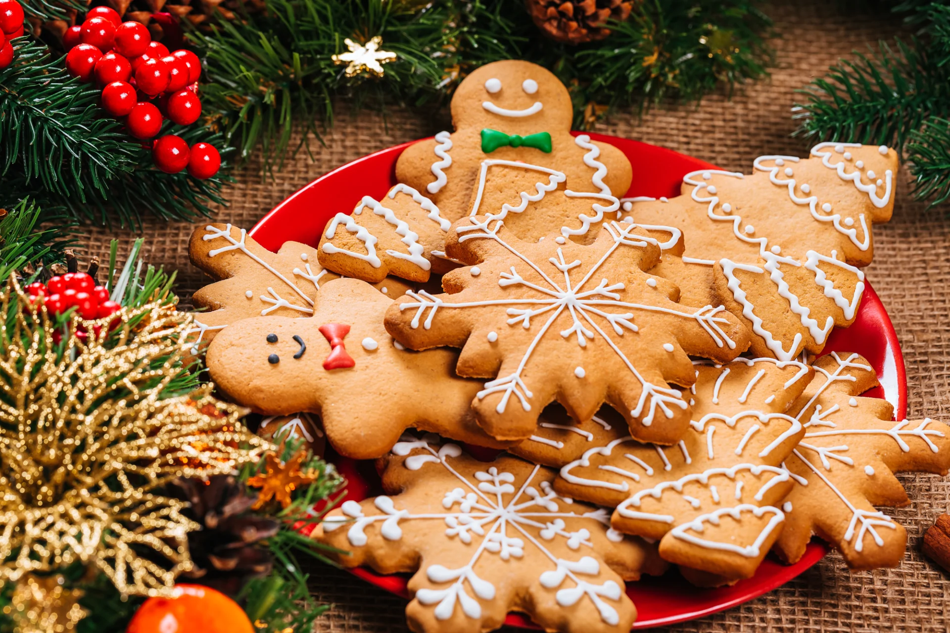 A red plate topped with lots of cookies.